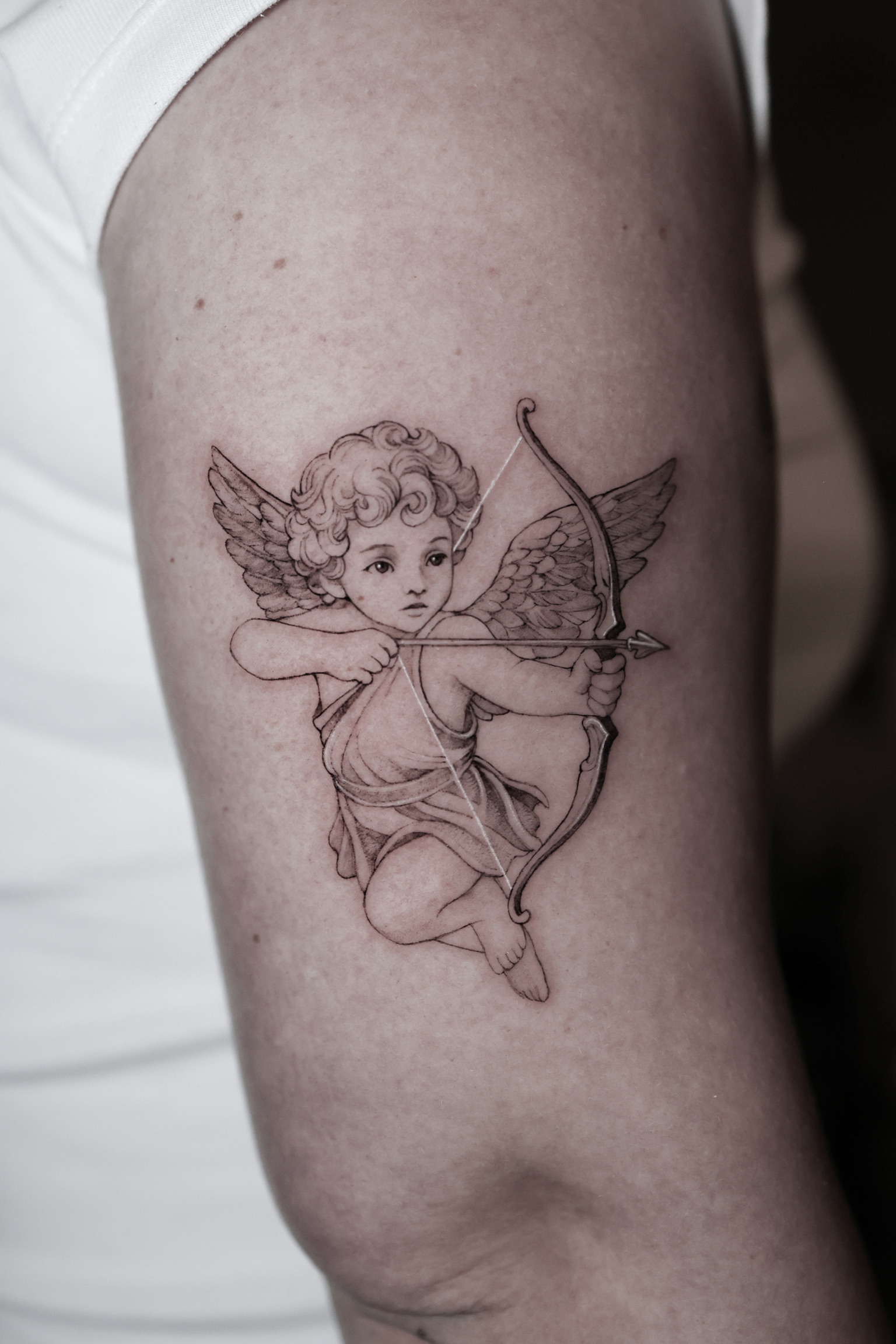 Cupid Bow - Black and Grey Tattoo by San Francisco Tattoo Artist ZKINK