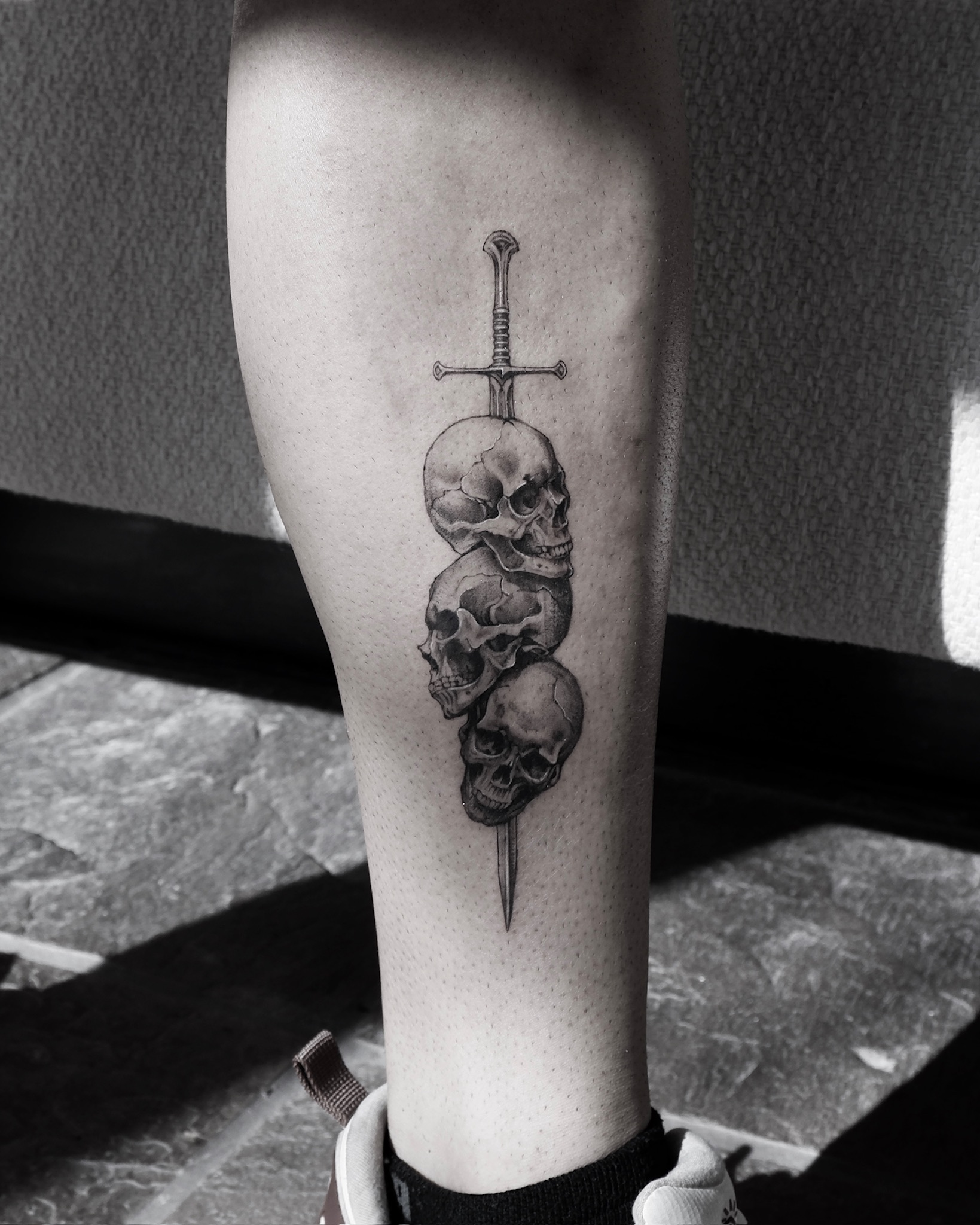 Skulls And Sword - Black and Grey Tattoo by San Francisco Tattoo Artist ZKINK